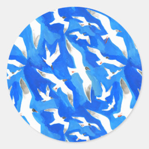 Flying seagulls on sky blue classic round sticker