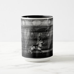 Focus coffee mug a carousel and horse blurred
