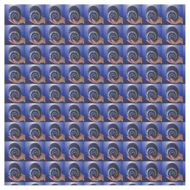 Focused Grip: Hand Holding a Blue Lawn Bowl  Fabric (Close Up)