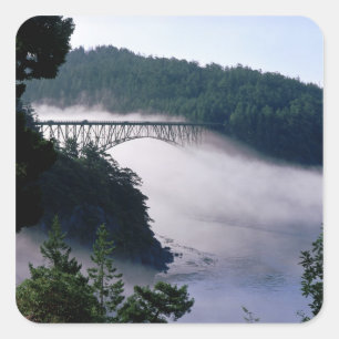 Fog drifts under the Deception Pass bridge at Square Sticker