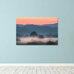 Foggy landscape at sunset canvas print