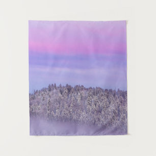 Foggy snow covered spruce forest at sunset tapestry