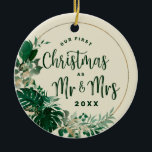 Foliage First Christmas as Mr & Mrs Newlywed Photo Ceramic Tree Decoration<br><div class="desc">Tropical Foliage Trendy Greenery and Gold Leaves Circle Frame Custom Wedding Photo Our First Christmas as Mr. and Mrs. Holiday Ornament - with tropical leaf border, Brushed Marker typography, and your Custom text. Add your special wedding day photo to the backside! in a bold colour palette of rich greens, emerald,...</div>