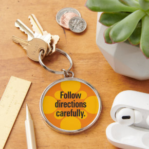 Follow directions carefully Orange Spots Key Ring