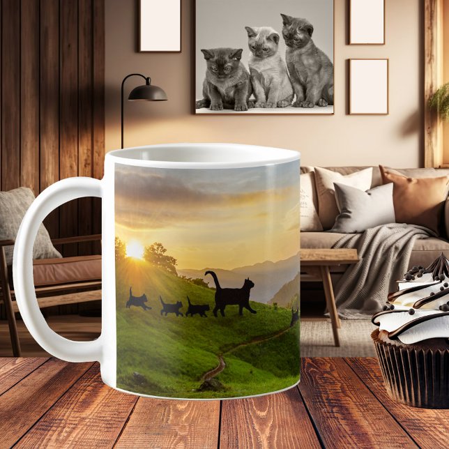 Following the Cat Trail Fun Family Mug (A fun and whimsical mug featuring cat families walking through a hilly landscape at sunset)