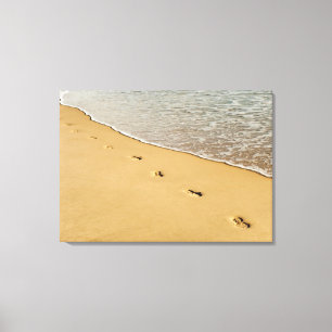 Foot prints in Sand with Wave