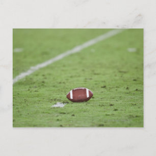 Football near yardage line. postcard