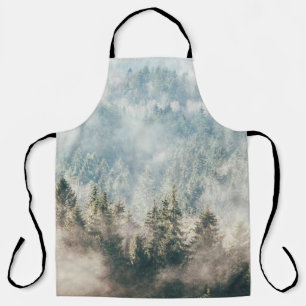 Forest covered in fog, mystery woods in early morn apron