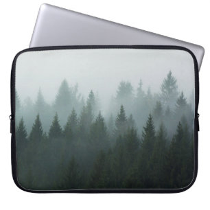Forest in the morning mist in the mountain. Spruce Laptop Sleeve