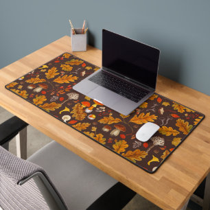 Forest mushrooms and autumn flora on brown desk mat