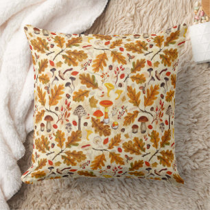 Forest mushrooms and autumn flora on cream cushion