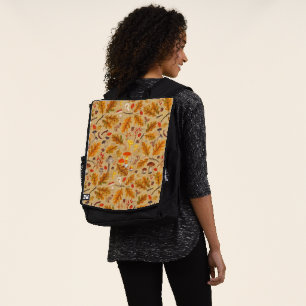 Forest mushrooms and autumn flora on ochre backpack