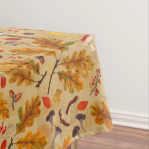 Forest mushrooms and autumn flora on ochre tablecloth