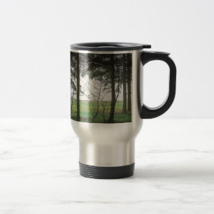 Forest overlooking clearing in the fog travel mug
