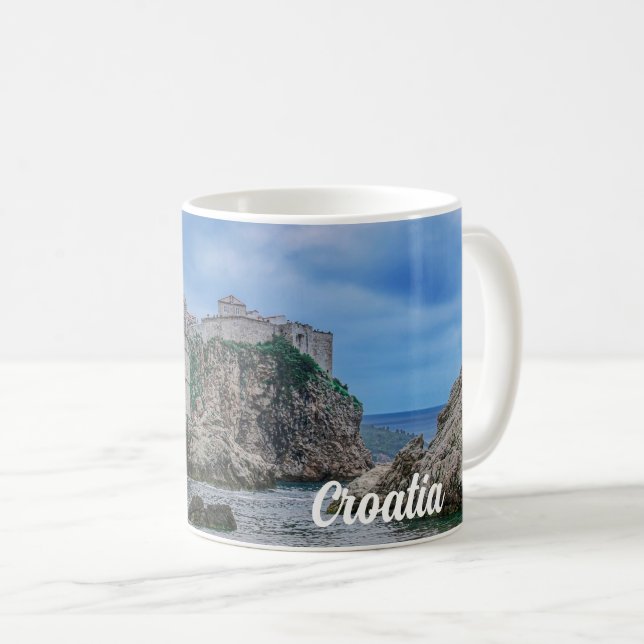 Fortress walls, rocky coast and sea in Croatia Coffee Mug (Front Right)