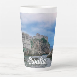 Fortress walls, rocky coast and sea in Croatia Latte Mug