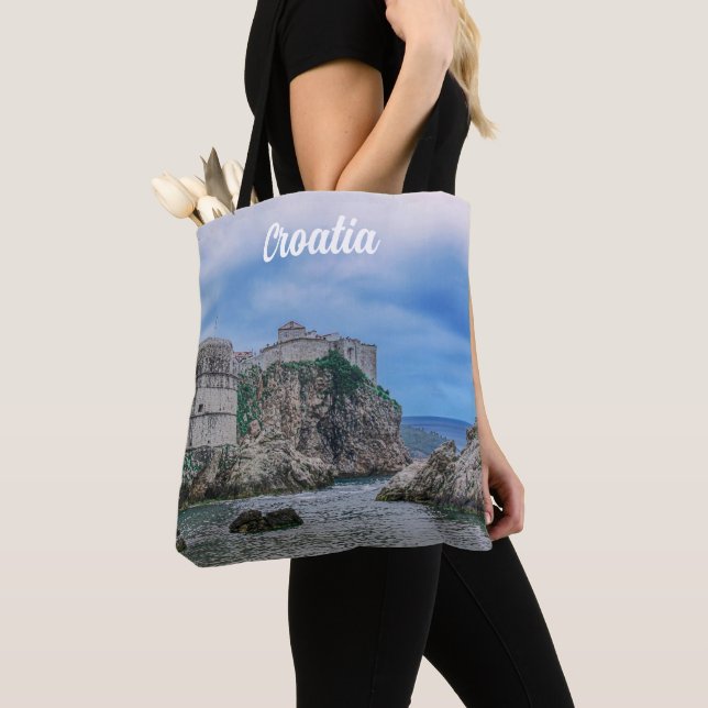 Fortress walls, rocky coast and sea in Croatia Tote Bag (Close Up)