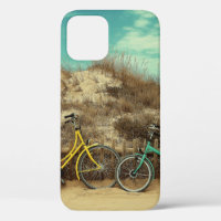 Four assorted-colour commuter bikes near hill at d