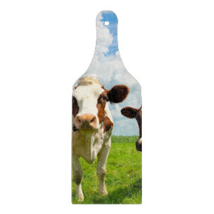 Four chatting cows cutting board