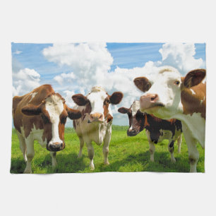 Four chatting cows tea towel