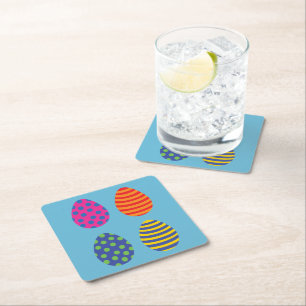Four coloured easter eggs square paper coaster