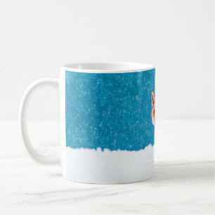 Fox in winter. Red fox, Vulpes vulpes, sniffs abou Coffee Mug
