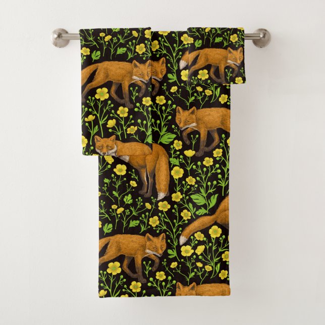 Foxes and buttercups on black bath towel set (Insitu)