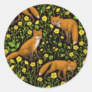 Foxes and buttercups on black classic round sticker