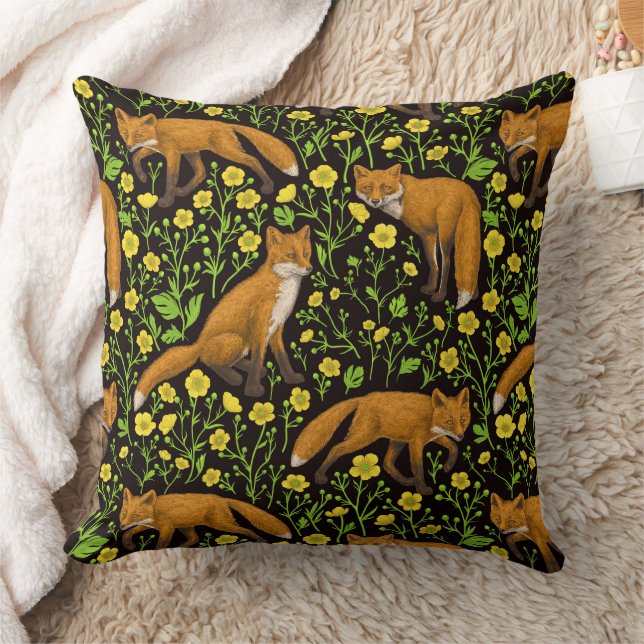 Foxes and buttercups on black cushion (Blanket)