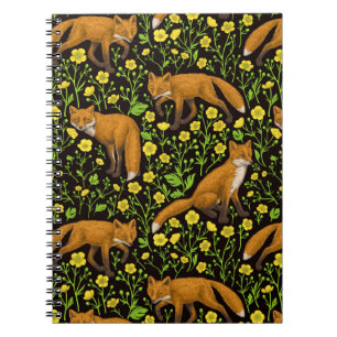 Foxes and buttercups on black notebook