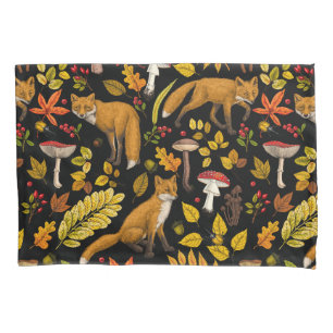 Foxes and buttercups on black pillowcase