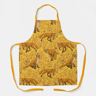 Foxes and buttercups on orange apron