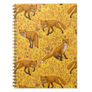 Foxes and buttercups on orange notebook