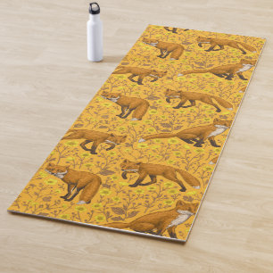 Foxes and buttercups on orange yoga mat