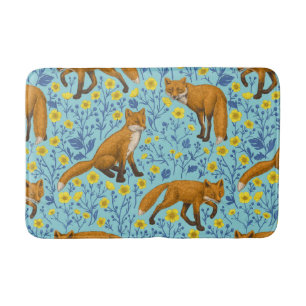 Foxes and buttercups on pool blue bath mat