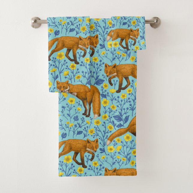 Foxes and buttercups on pool blue bath towel set (Insitu)