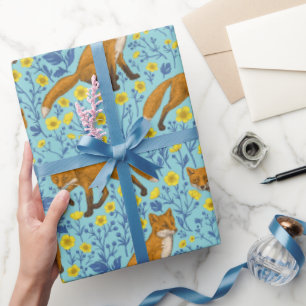 Foxes and buttercups on pool blue wrapping paper