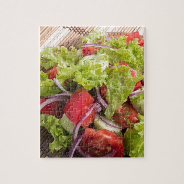 Fragment of vegetarian salad from fresh vegetables jigsaw puzzle (Vertical)