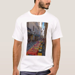 France, Corsica. Tables of cafe set up in narrow T-Shirt