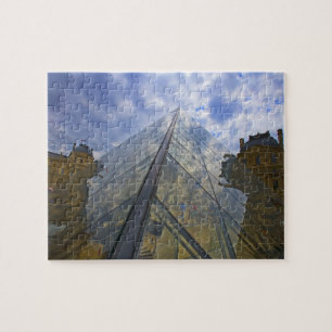 France, Paris. Clouds reflect off the Louvre Jigsaw Puzzle