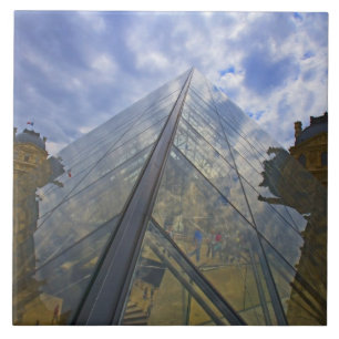 France, Paris. Clouds reflect off the Louvre Tile