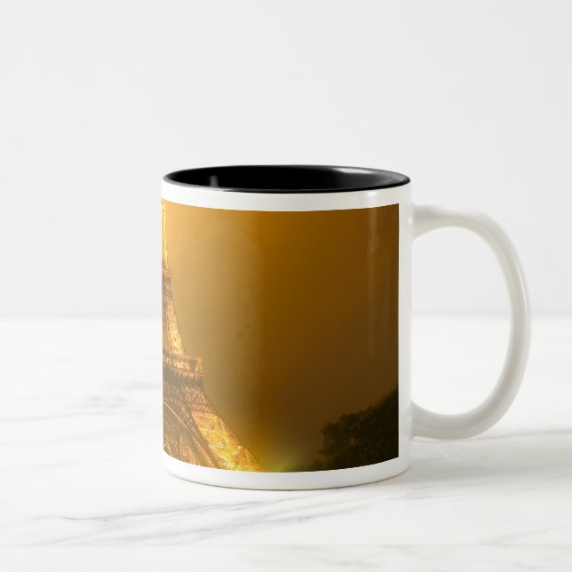 France, Paris. Eiffel Tower illuminated at 3 Two-Tone Coffee Mug (Right)