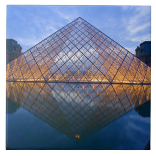 France, Paris. The Louvre at twilight. Credit Tile