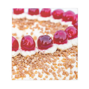 Frankfurt crown cake with cherries on rustic wood notepad