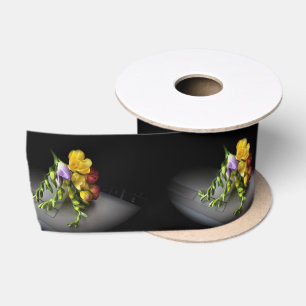 Freesias under spotlight satin ribbon
