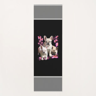 French bulldog with three bulldoggs in pink yoga mat