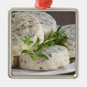French goat cheese - chevre - with herbs on a metal tree decoration