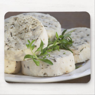 French goat cheese - chevre - with herbs on a mouse mat