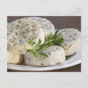 French goat cheese - chevre - with herbs on a postcard