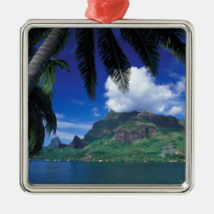 French Polynesia, Moorea. Cooks Bay. Green Metal Tree Decoration